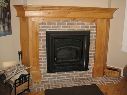 Firebox restoration with restored bricks and new pine wood mantel