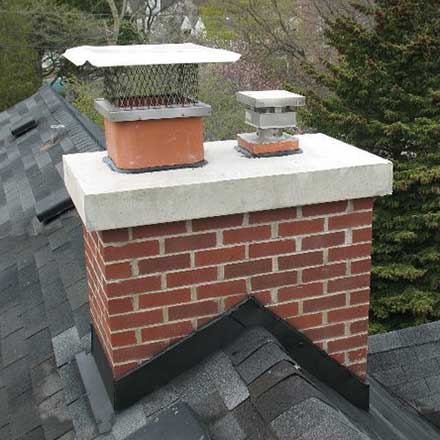 Brick Chimney with Restored Masonry, New Crown, and New Caps